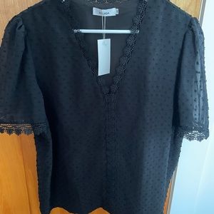 Black dotted top with sheer sleeves, lace detail.  Size M Belinda